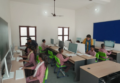 Volunteers teaching children through Atulya Foundation