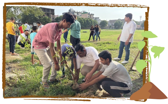 Community members, including young volunteers, actively participating in a tree plantation drive organized by Atulya Foundation to promote a greener environment.
