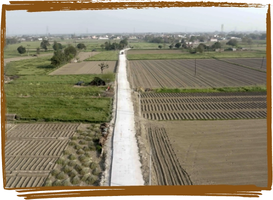 Visual of an all-weather road connecting remote rural communities, promoting ease of travel.